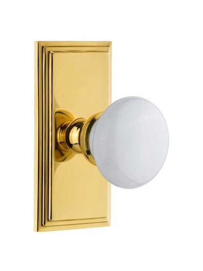 Grandeur Carre Rosette Door Set with Hyde Park White Porcelain Knobs in Polished Brass.